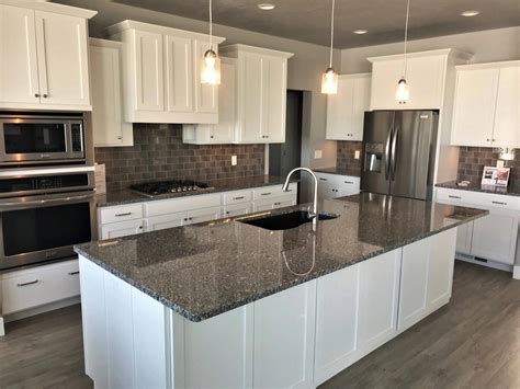 white kitchen cabinets with steel gray granite countertops|dark granite with white cabinets.